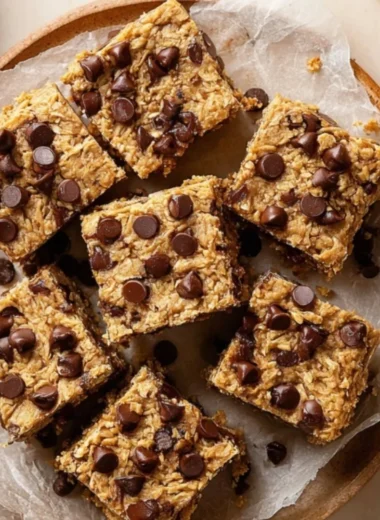 Delicious 4 ingredient peanut butter banana bars on a wooden cutting board