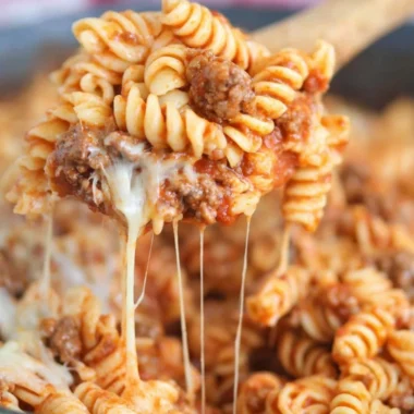 Delicious Cheesy Taco Pasta served in a bowl with toppings