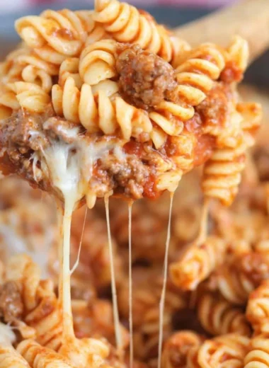 Delicious Cheesy Taco Pasta served in a bowl with toppings