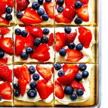 Delicious easy fruit pizza topped with fresh fruits and creamy frosting