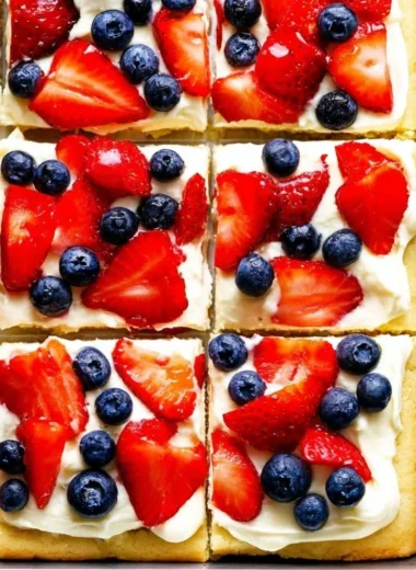 Delicious easy fruit pizza topped with fresh fruits and creamy frosting