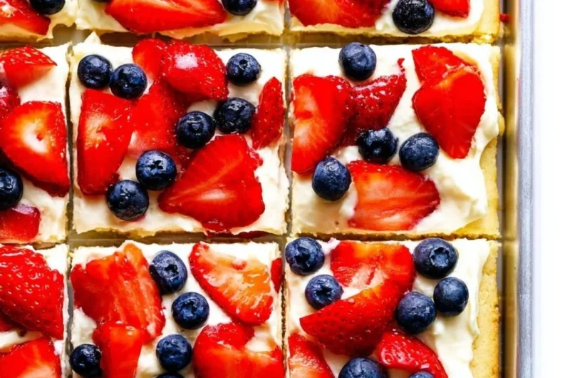 Delicious easy fruit pizza topped with fresh fruits and creamy frosting