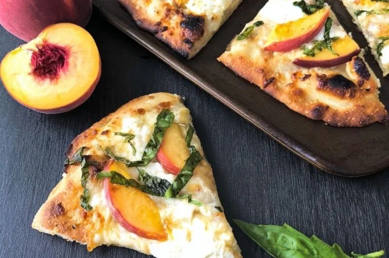 Easy Peach Basil Naan Pizza topped with fresh basil and peaches