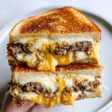 Smashburger grilled cheese sandwich with special sauce on a rustic plate