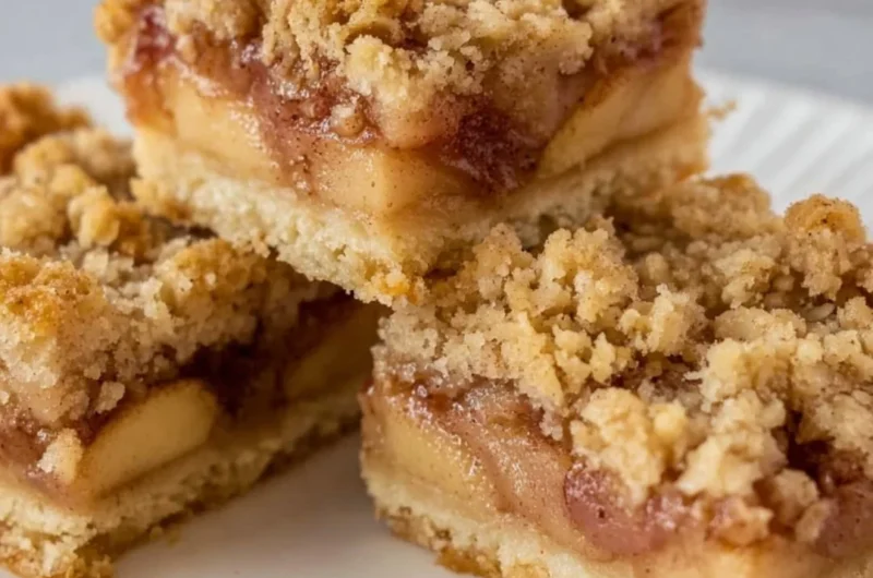 Delicious homemade Apple Pie Bars on a wooden table