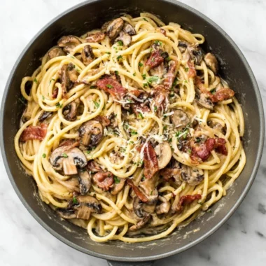 Bacon Mushroom Pasta in a creamy sauce with crispy bacon and fresh mushrooms