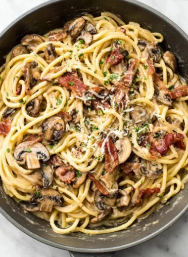 Bacon Mushroom Pasta in a creamy sauce with crispy bacon and fresh mushrooms