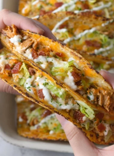 Baked chicken bacon ranch tacos topped with fresh ingredients and spices