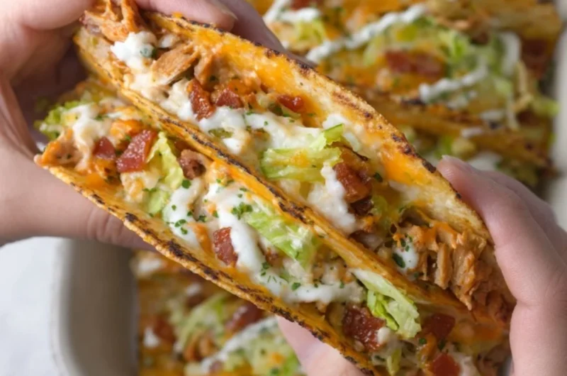 Baked chicken bacon ranch tacos topped with fresh ingredients and spices