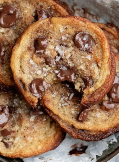 Freshly baked banana chocolate chip cookies on a cooling rack