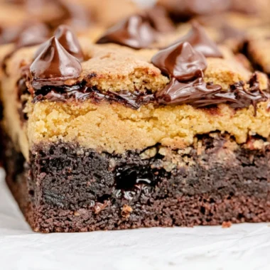Delicious brown butter brookies served on a plate with chocolate chips.