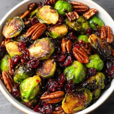 Brussels sprouts with bacon, pecans, and cranberries topped with balsamic glaze