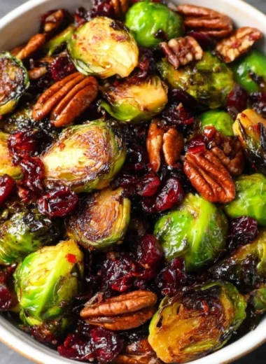 Brussels sprouts with bacon, pecans, and cranberries topped with balsamic glaze