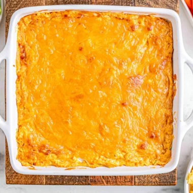 Cheesy Creamy Buffalo Chicken Dip served in a bowl with crackers