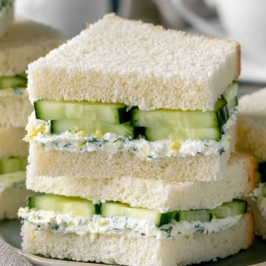Delicious cucumber sandwiches on a platter, perfect for tea parties.