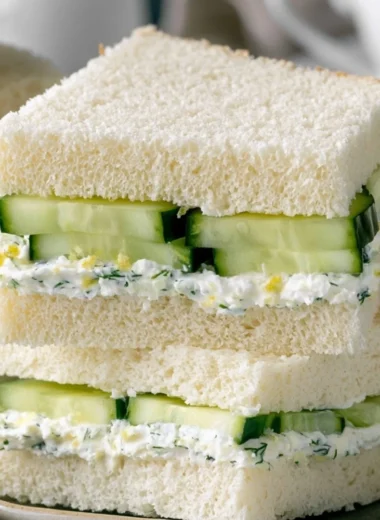 Delicious cucumber sandwiches on a platter, perfect for tea parties.