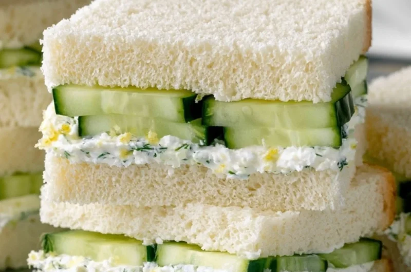 Delicious cucumber sandwiches on a platter, perfect for tea parties.