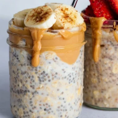 Bowl of high-protein overnight oats topped with fruits and nuts