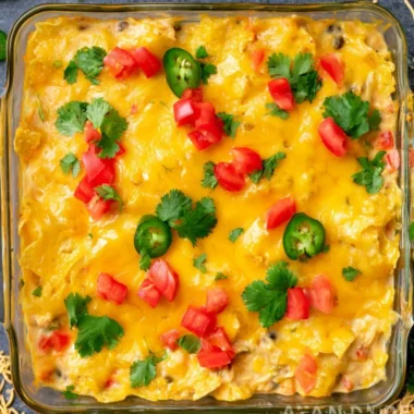 Mexican Chicken Casserole served in a baking dish garnished with herbs
