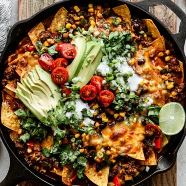 Delicious one-pan beef enchiladas topped with cheese and garnished with cilantro
