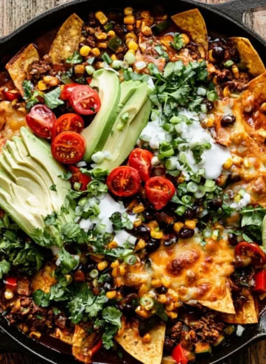 Delicious one-pan beef enchiladas topped with cheese and garnished with cilantro