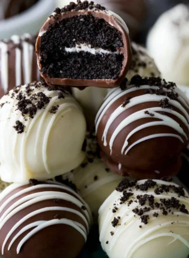 Decadent homemade Oreo Truffles on a white plate, ready to be enjoyed.