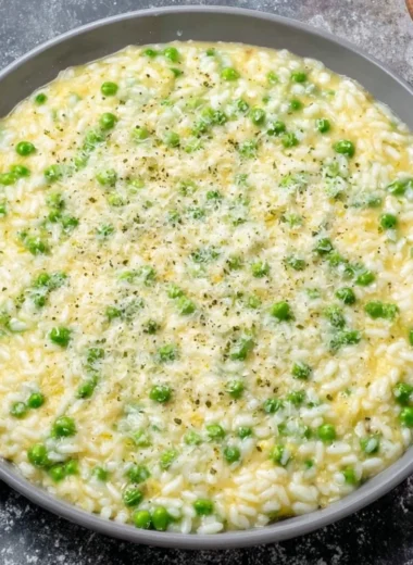 Delicious plate of rice and peas served with fresh herbs and spices.