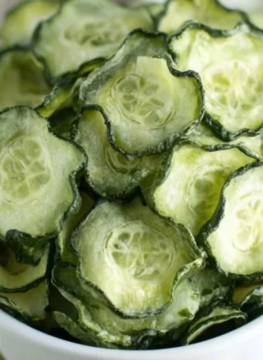 Bowl of salt and vinegar cucumber chips seasoned to perfection.