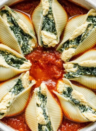 Delicious vegan stuffed shells with plant-based filling and marinara sauce