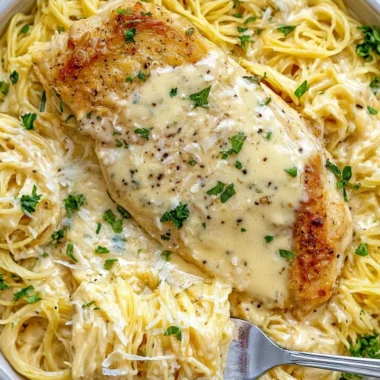Plate of Crock Pot Angel Chicken served with rice and vegetables