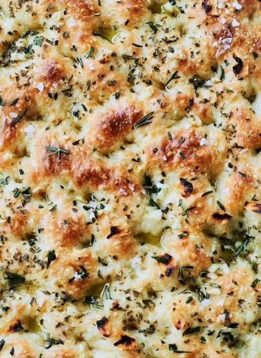 Homemade focaccia bread with herbs and olive oil