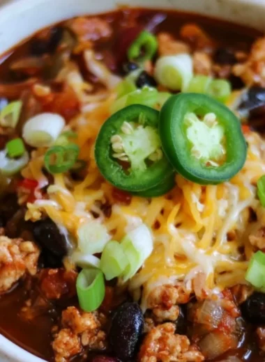 Healthy high protein chili dish with fresh ingredients served in a bowl