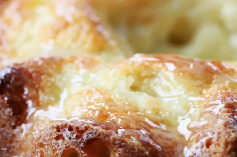 Delicious Lemon Bundt Cake garnished with lemon slices and icing.