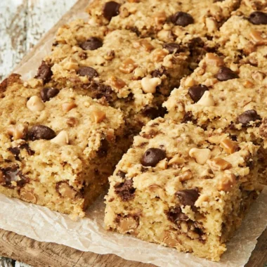 Loaded chocolate chip cookie bars with melted chocolate