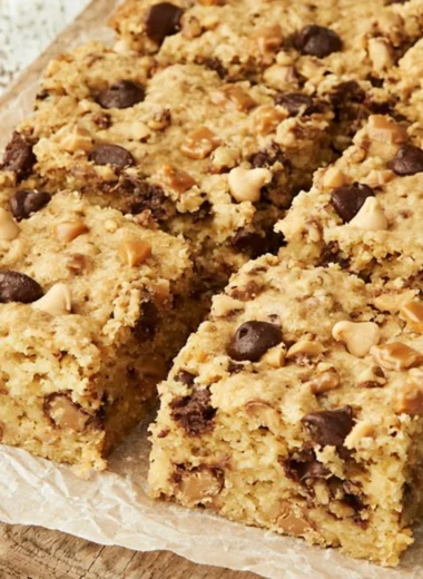 Loaded chocolate chip cookie bars with melted chocolate