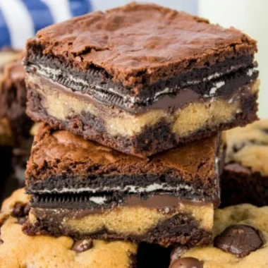 Delicious Oreo brownies topped with cookie dough in a baking dish.