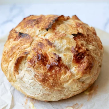 Freshly baked sourdough croissant bread with golden flaky layers