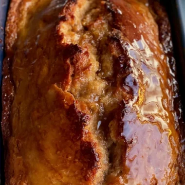Sourdough discard banana bread fresh from the oven with a golden brown crust.