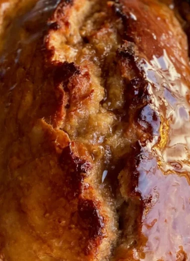 Sourdough discard banana bread fresh from the oven with a golden brown crust.