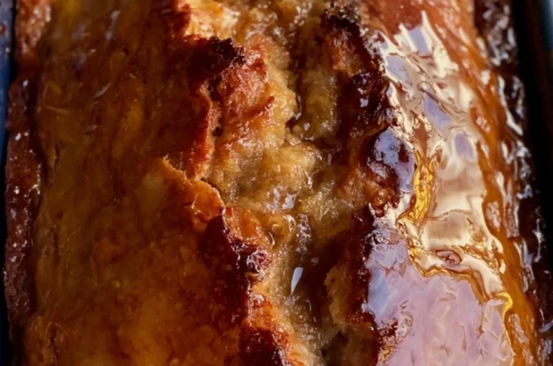 Sourdough discard banana bread fresh from the oven with a golden brown crust.
