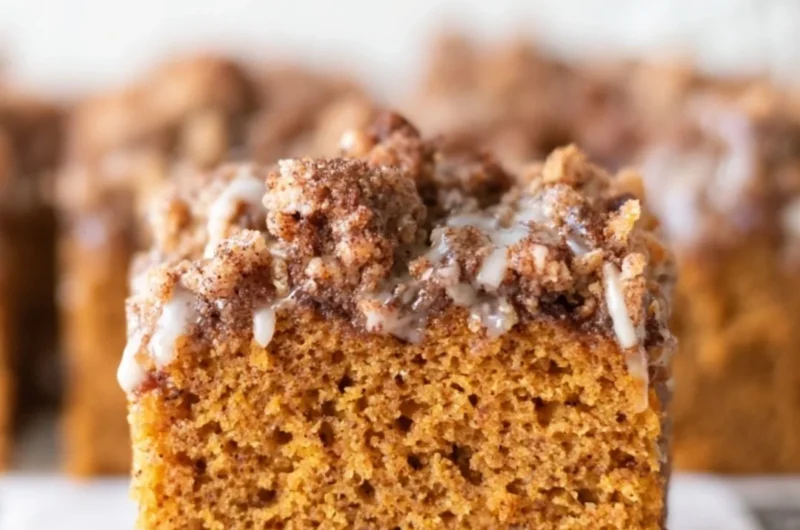 Delicious pumpkin cake topped with crumb and maple cream cheese glaze