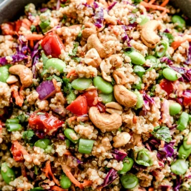 Delicious Thai Quinoa Salad with fresh vegetables and dressing.