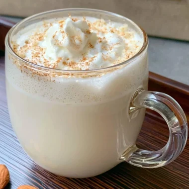 Delicious Vanilla Almond Snowflake Latte topped with whipped cream and almonds