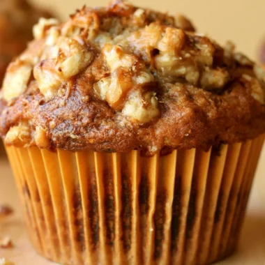 Freshly baked Banana Nut Muffins on a wooden serving board