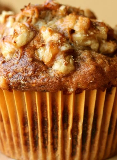 Freshly baked Banana Nut Muffins on a wooden serving board