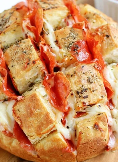 Pepperoni pizza pull-apart bread appetizer served on a platter