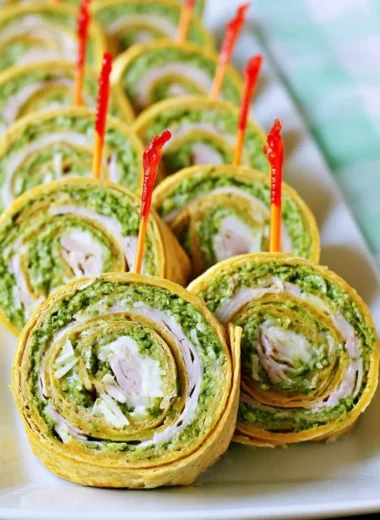 Pesto tortilla pinwheels served as a colorful and appealing appetizer.