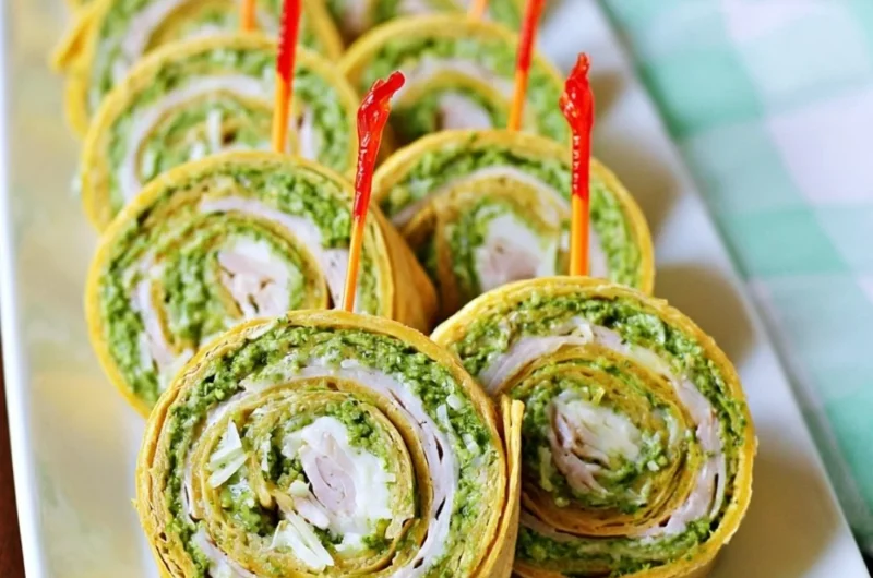 Pesto tortilla pinwheels served as a colorful and appealing appetizer.